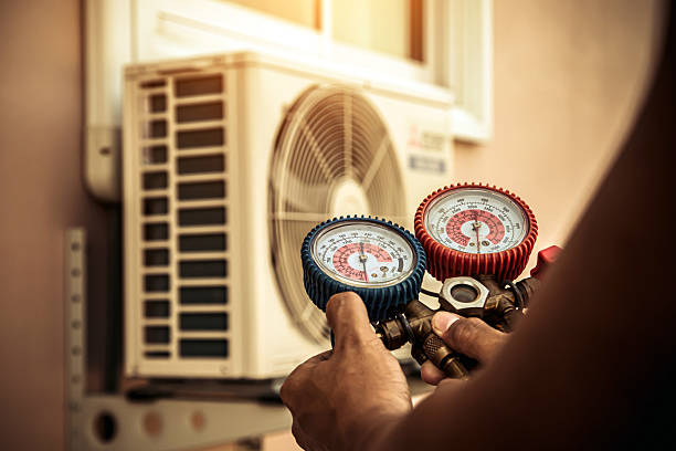 Professional Air Conditioning Service technician working in Gunpowder, MD